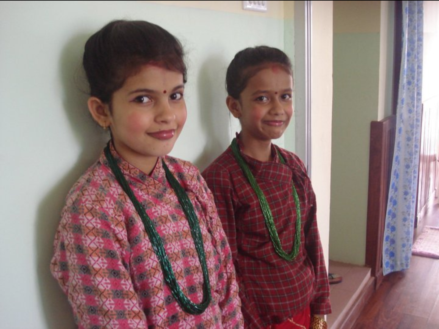 Nanu and Priti ready to perform a cultural dance.